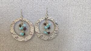 Silver tone hoop earrings with beads